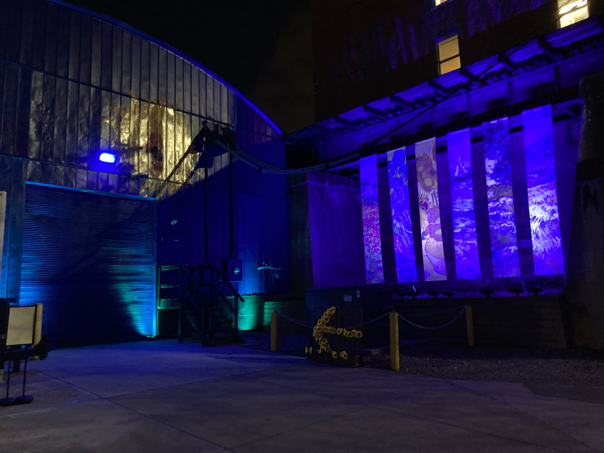 Banners Are Illuminated Outside Of A Warehouse