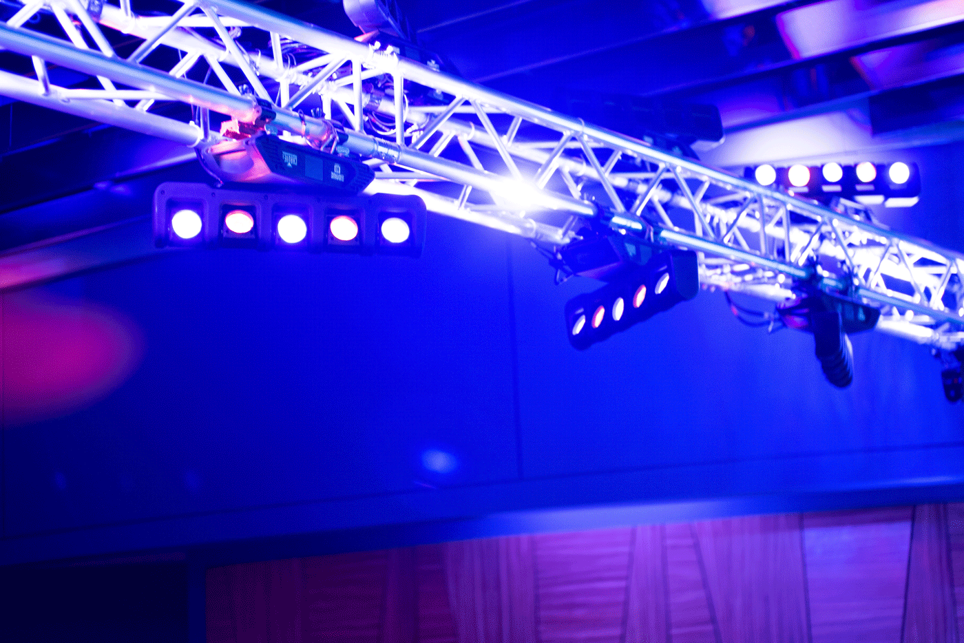 Close up of lights rigged to a truss structure