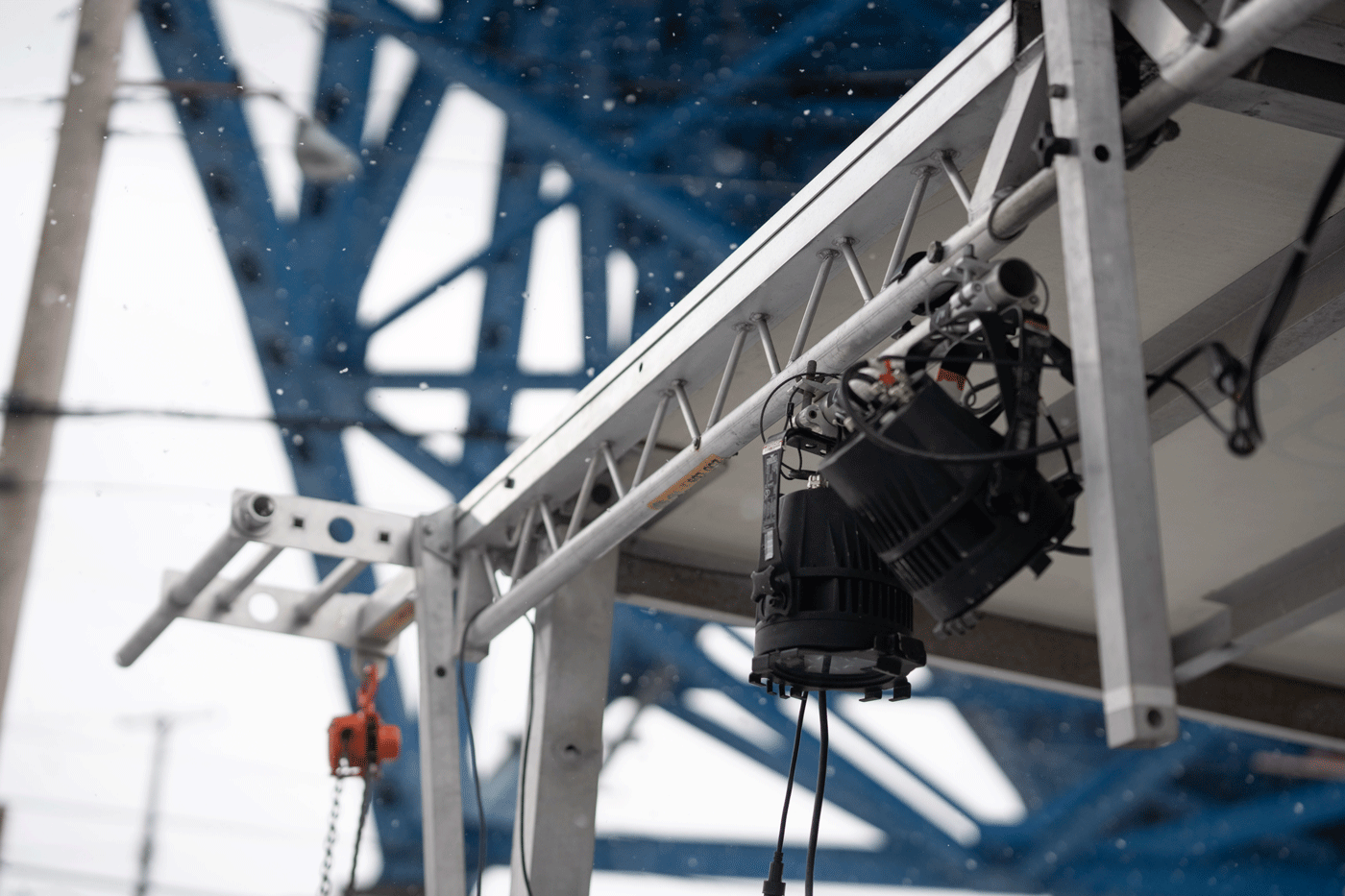 lights hang from a truss structure