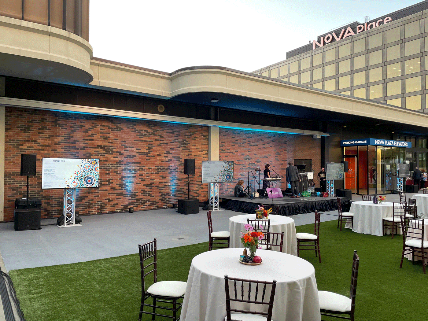 Stage outside surrounded by set tables