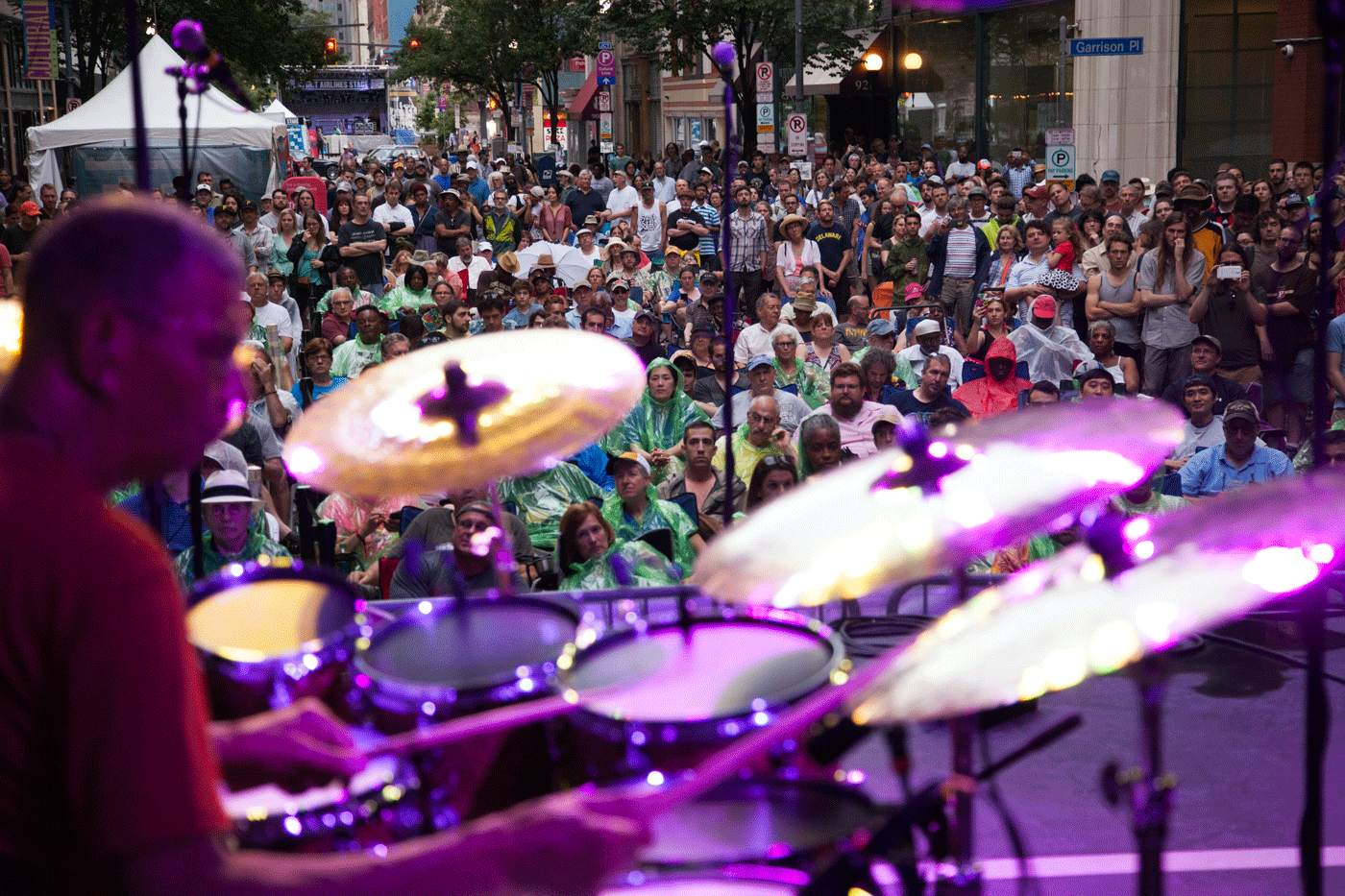 a drummer plays in front of a crowd