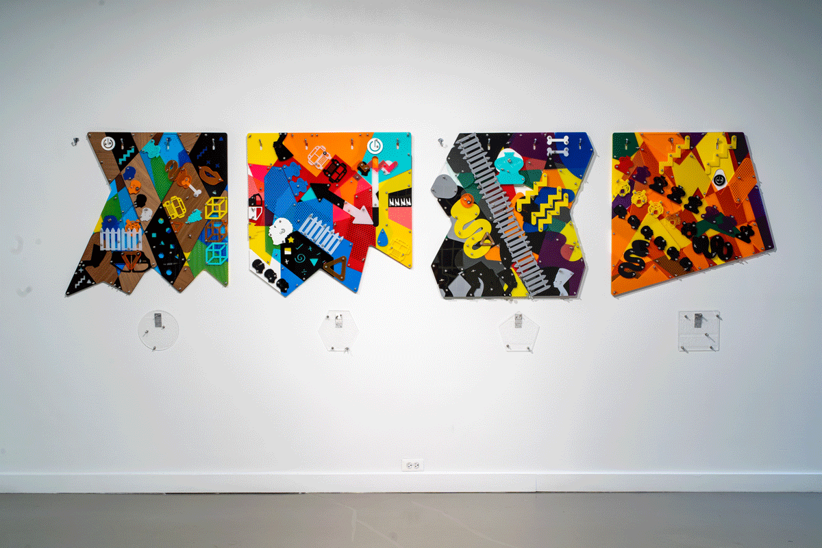 Colorful Works of Art Hang On a White Wall